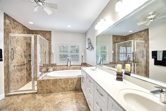 bathroom featuring shower with separate bathtub, ceiling fan, and vanity