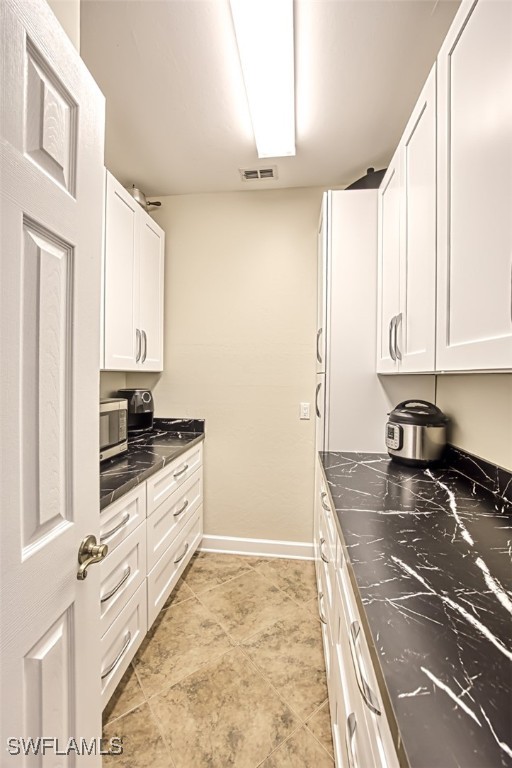 kitchen with white cabinetry