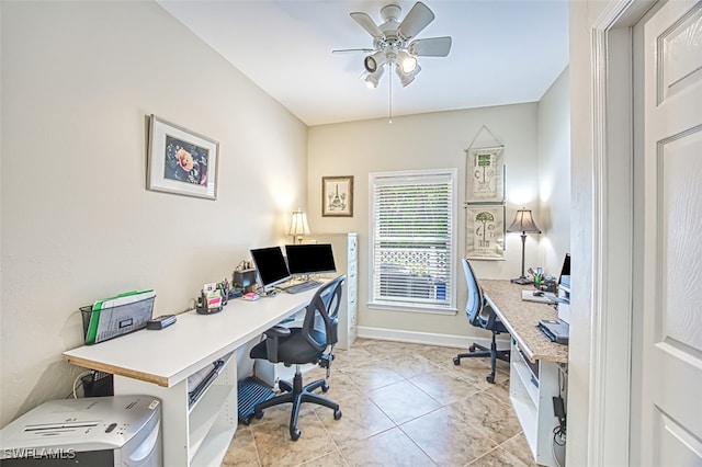 tiled office space featuring ceiling fan