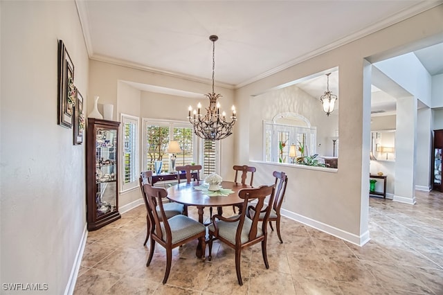 dining space with a chandelier and crown molding