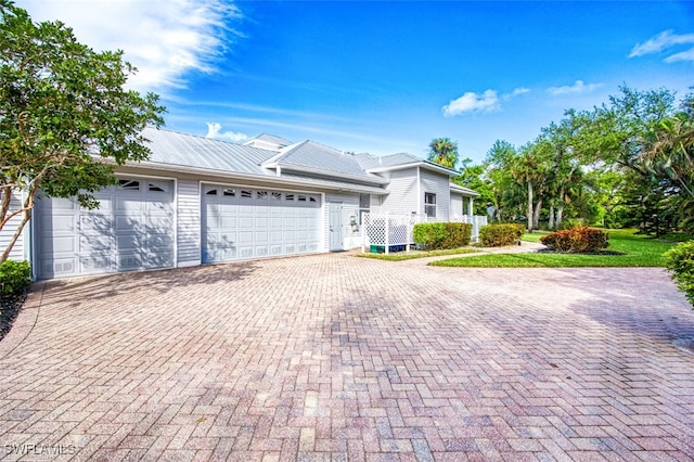 single story home with a garage