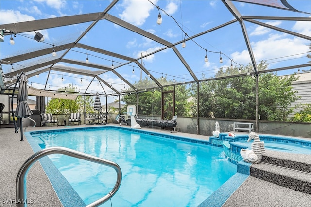 view of pool featuring a lanai and a patio area