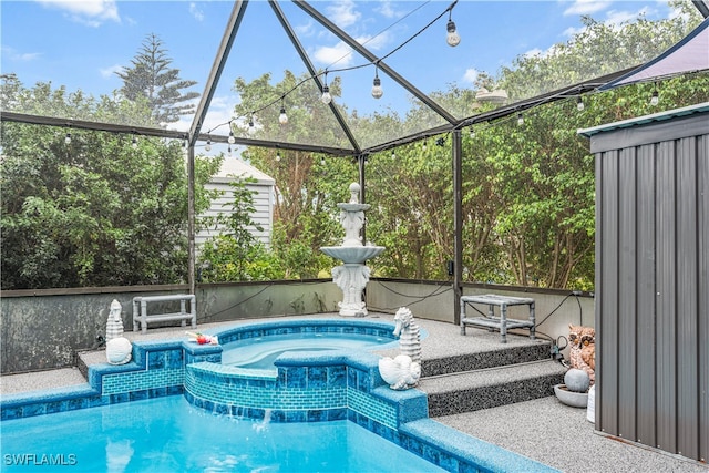 view of swimming pool with a lanai and an in ground hot tub