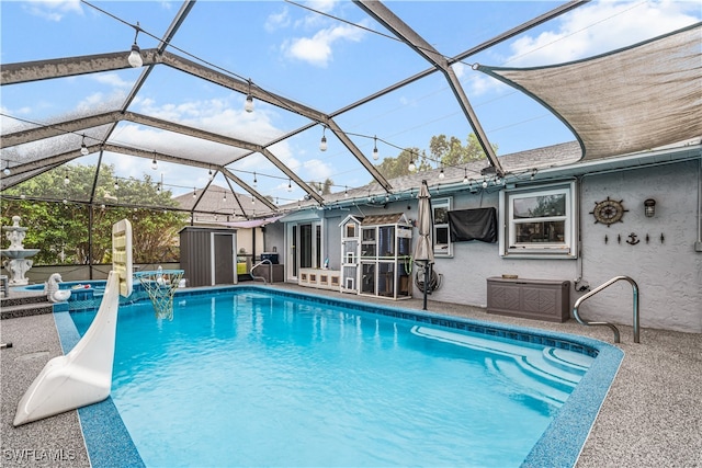 view of pool with a lanai and a patio