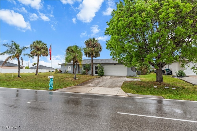 view of front of house featuring a garage and a front yard