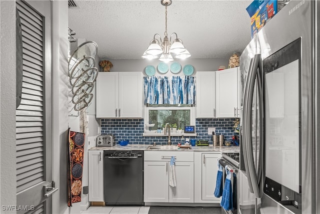 kitchen featuring white cabinetry, stainless steel appliances, and tasteful backsplash