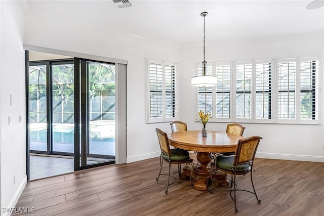 dining space featuring hardwood / wood-style floors