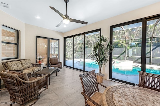 sunroom with ceiling fan and a healthy amount of sunlight