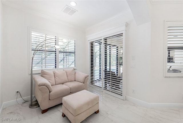 sitting room with crown molding