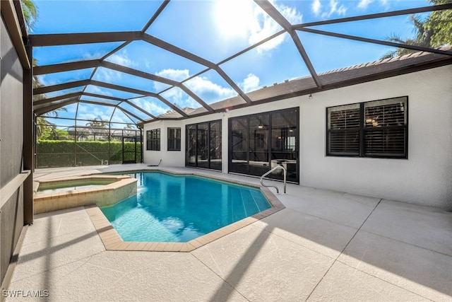 view of swimming pool with an in ground hot tub, a patio, and a lanai