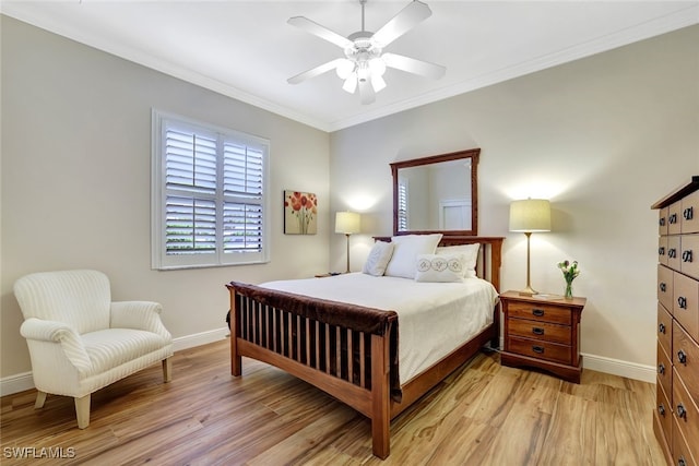 bedroom with ceiling fan, crown molding, and light hardwood / wood-style floors