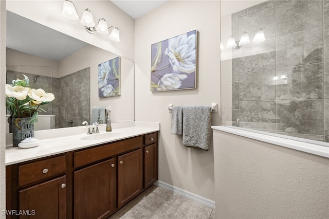 bathroom featuring vanity and a tile shower