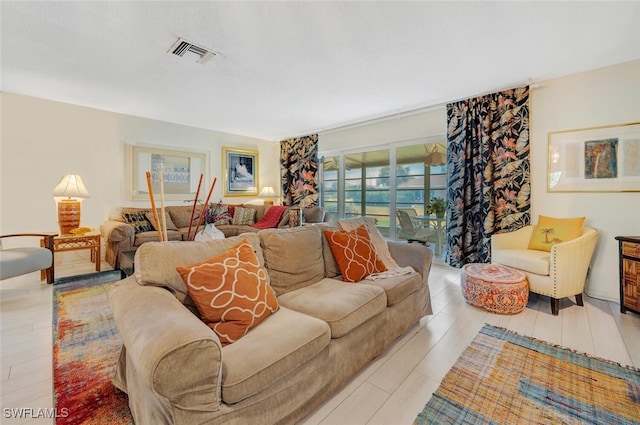 living room with light hardwood / wood-style flooring