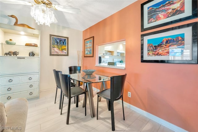 dining area featuring a textured ceiling and ceiling fan