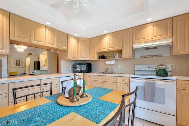 kitchen with light brown cabinets, sink, white electric range oven, and a tray ceiling