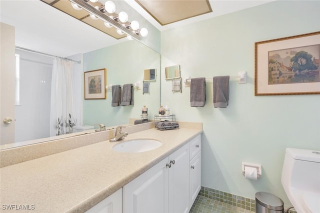 bathroom featuring toilet, vanity, tile patterned flooring, and walk in shower