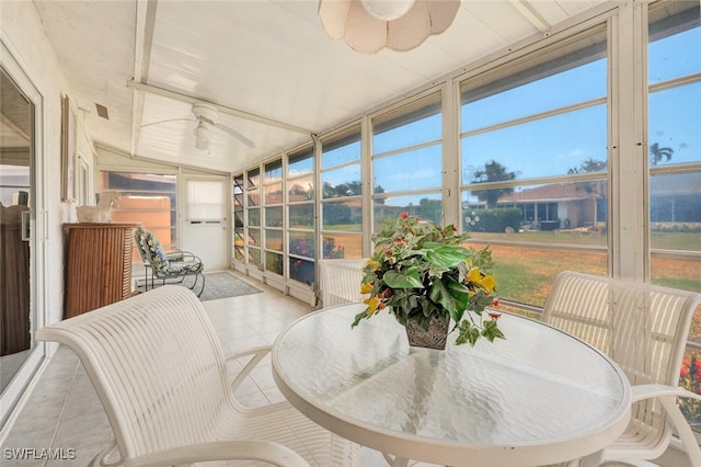 sunroom / solarium featuring vaulted ceiling and ceiling fan