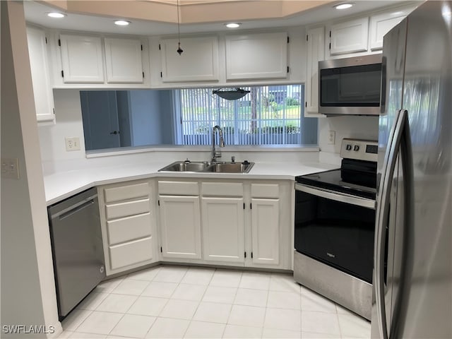 kitchen with white cabinets, sink, and appliances with stainless steel finishes