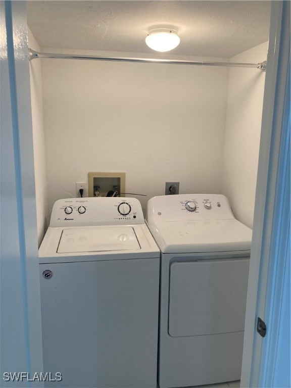 laundry room with washer and dryer