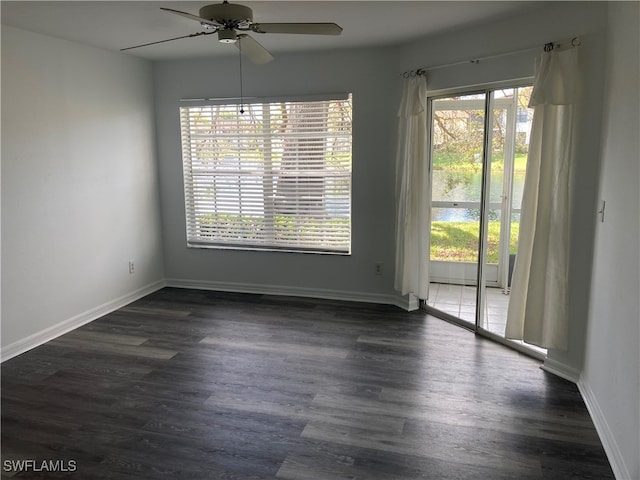 unfurnished dining area with dark hardwood / wood-style flooring, ceiling fan, and plenty of natural light