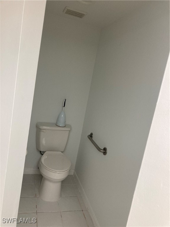 bathroom featuring tile patterned floors and toilet