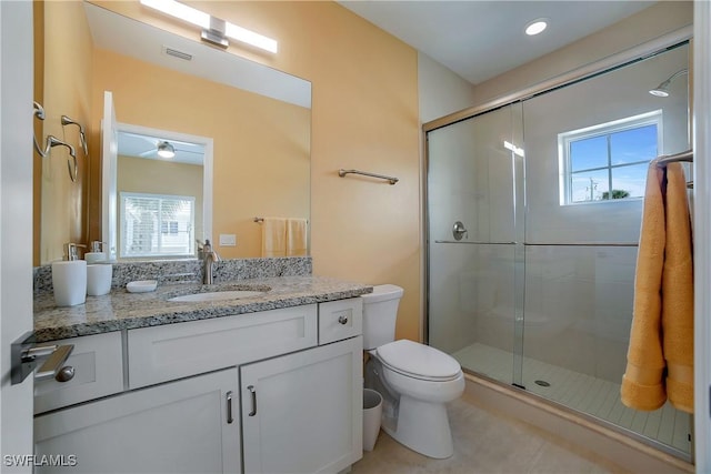 full bathroom with a shower stall, vanity, visible vents, and a healthy amount of sunlight