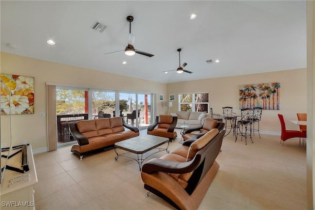 living room with recessed lighting, visible vents, and baseboards