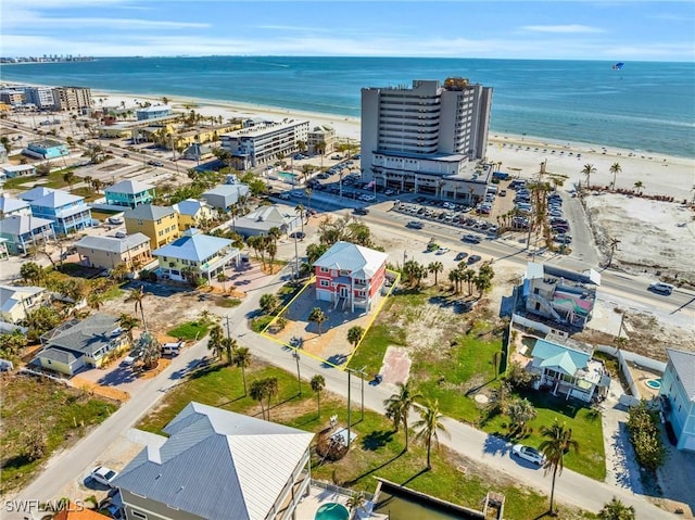 drone / aerial view with a view of the beach and a water view