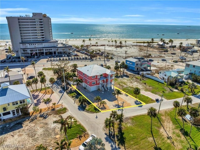 aerial view featuring a view of the beach and a water view