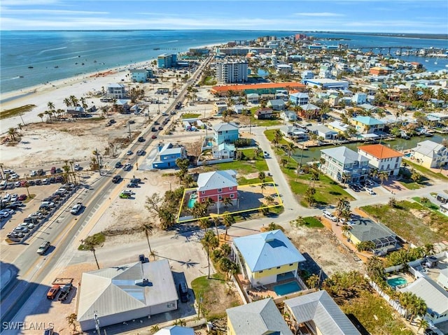 aerial view with a water view and a view of the beach