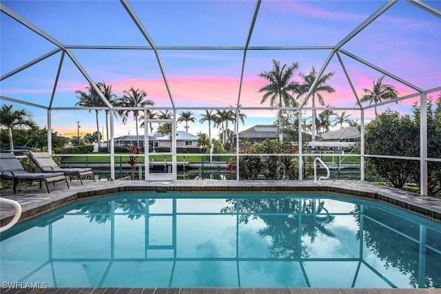 pool featuring a lanai and a patio area