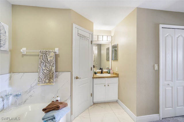 bathroom with a tub, baseboards, a closet, and vanity