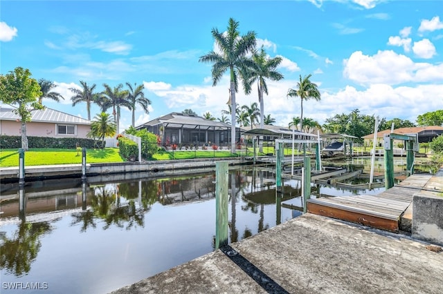 view of dock with a residential view, a water view, and boat lift