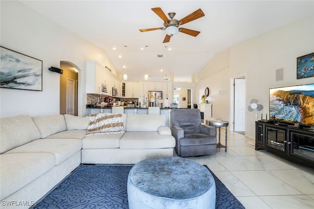 living area featuring arched walkways, recessed lighting, visible vents, a ceiling fan, and marble finish floor