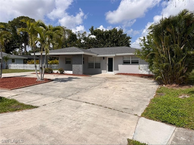 4562 Tennyson Dr, North Fort Myers, FL 33903 - ranch-style house with stucco siding and driveway