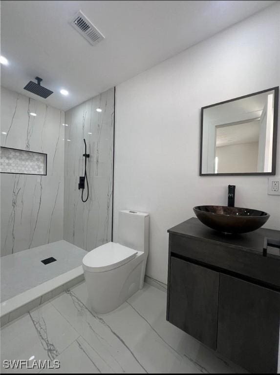 4562 Tennyson Dr, North Fort Myers, FL 33903 - bathroom featuring marble finish flooring, vanity, a marble finish shower, and recessed lighting