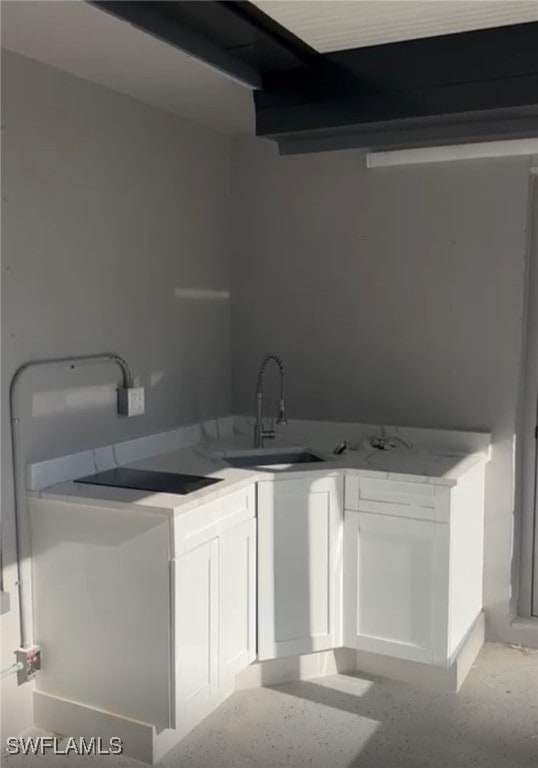 kitchen with white cabinets and sink