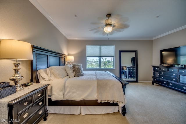 carpeted bedroom featuring ceiling fan and ornamental molding