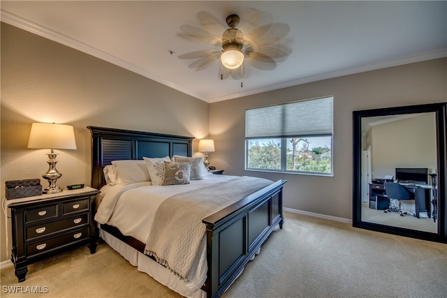 carpeted bedroom featuring ornamental molding and ceiling fan