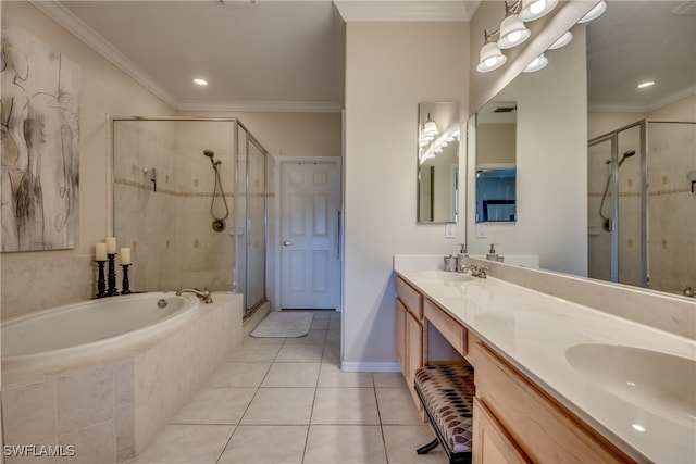 bathroom featuring tile patterned flooring, shower with separate bathtub, crown molding, and vanity