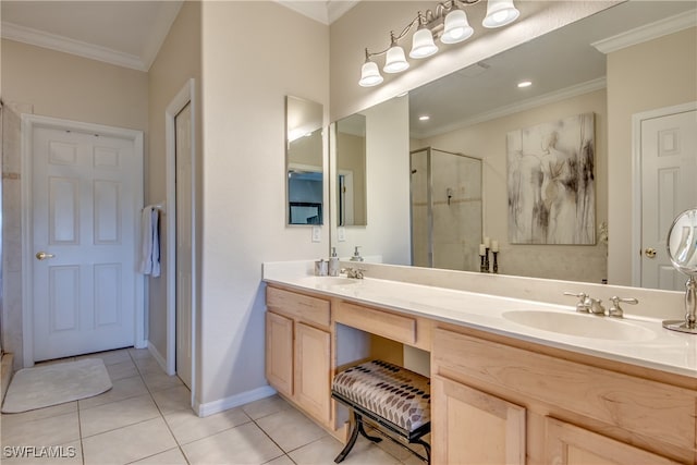 bathroom with vanity, a shower with shower door, tile patterned floors, and crown molding