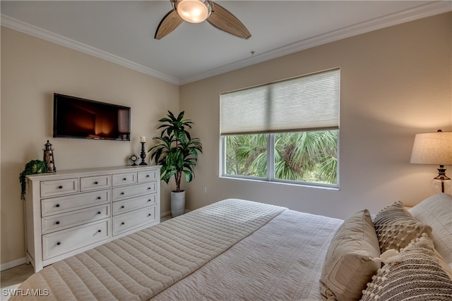 bedroom with ornamental molding and ceiling fan