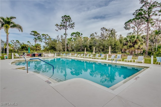 view of swimming pool featuring a patio area