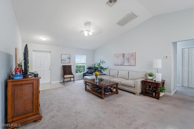 living room with ceiling fan, light carpet, and lofted ceiling