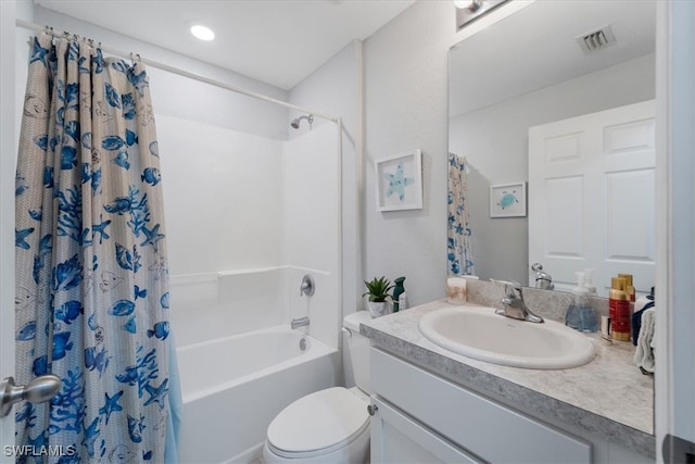 full bathroom featuring toilet, vanity, and shower / bath combo with shower curtain