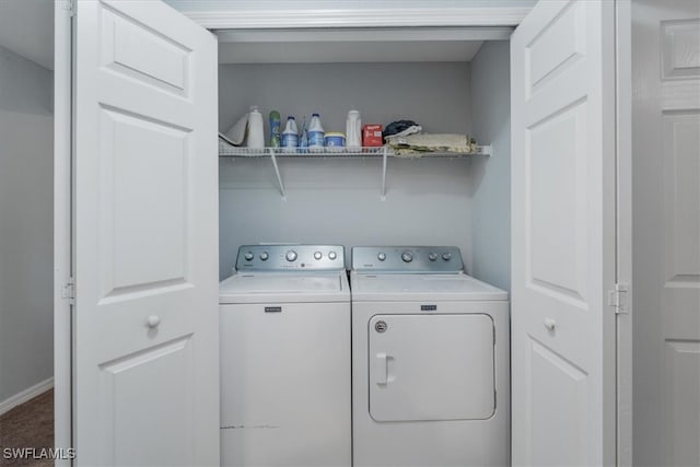 washroom featuring washer and clothes dryer