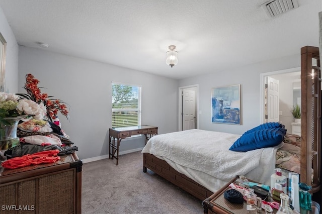 bedroom with light colored carpet