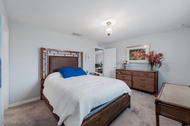 bedroom with light carpet