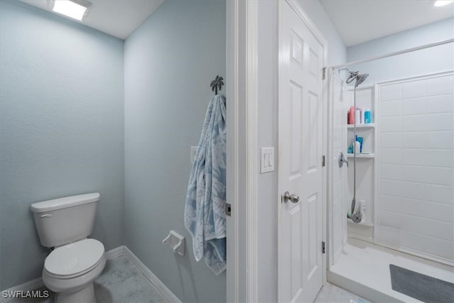 bathroom with toilet and a shower