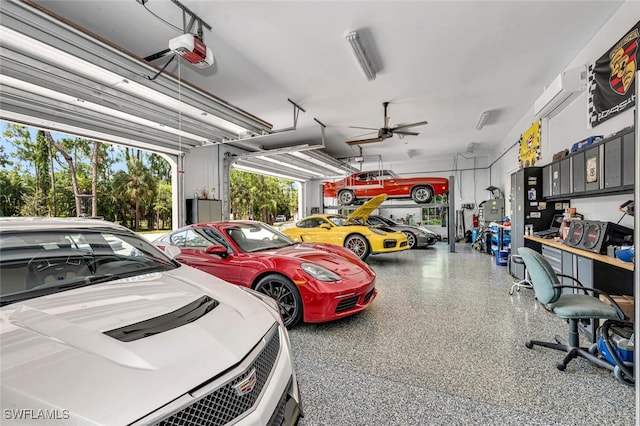 garage featuring ceiling fan, a garage door opener, and a wall mounted air conditioner